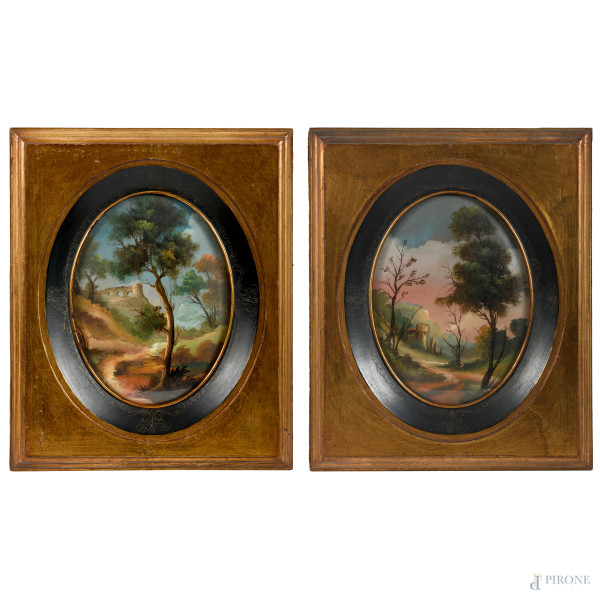 Coppia di paesaggi, XX secolo, olio su cartoncino a serto ovale, cm 24x18, entro cornice