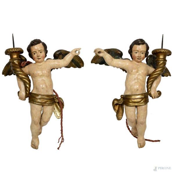 Coppia di angeli portacero in legno dipinto e dorato, XVIII secolo, altezza cm 84, (segni di usura, scalfiture, cadute di colore, restauri, difetti)