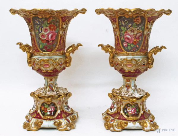 Coppia vasi Luigi Filippo, in porcellana policroma dipinta con riserve a fiori, particolari dorati, H 35 cm.