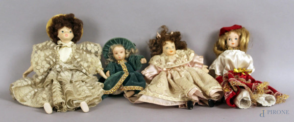 Lotto composto da quattro bambole in porcellana, altezza 28 cm.