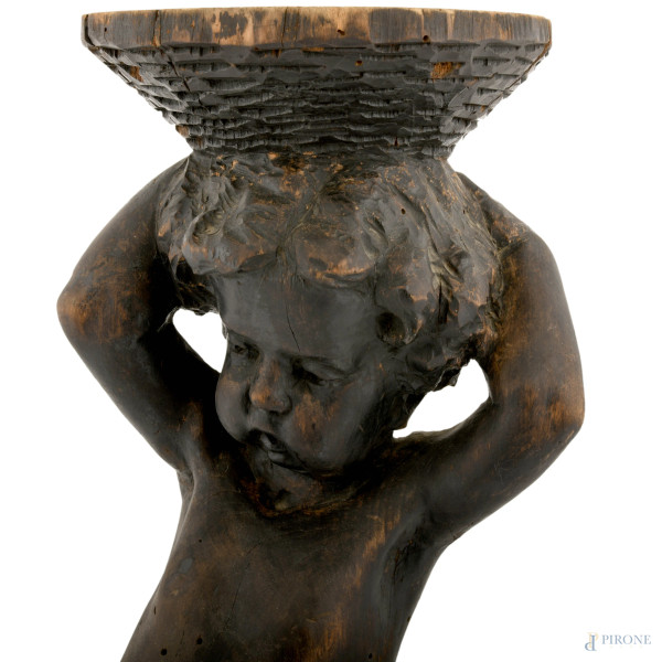 Piedistallo a foggia di putto in legno ebanizzato scolpito, XX secolo, cm 73