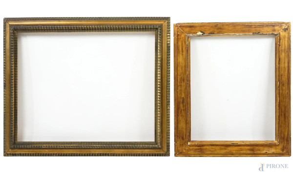 Due cornici in legno intagliato e dorato, XX secolo, misure max cm 86,5x73, (difetti)