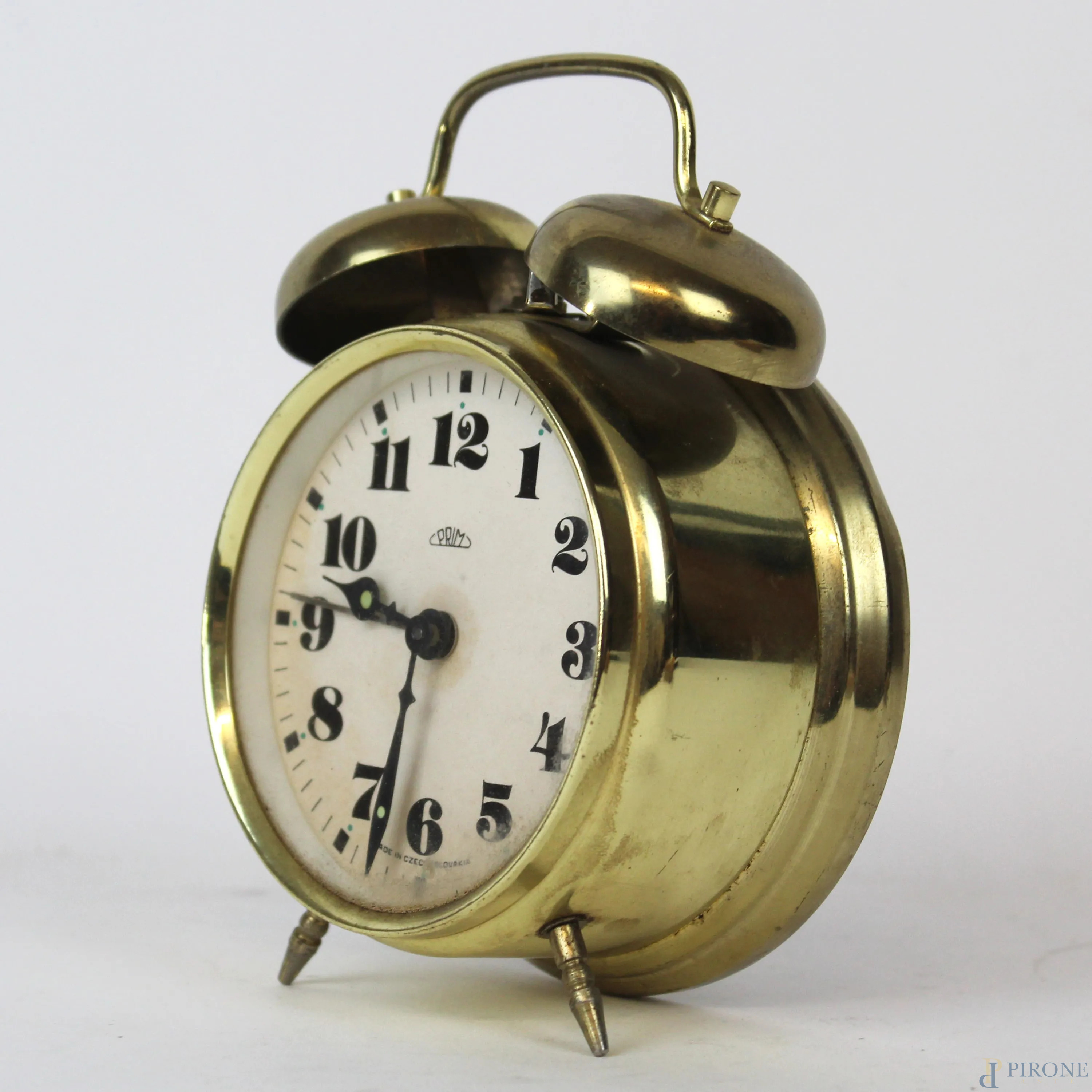 Orologio sveglia vintage in metallo, altezza cm 15 - Asta ASTA DI ARTE  MODERNA E ANTIQUARIATO - Aste Pirone