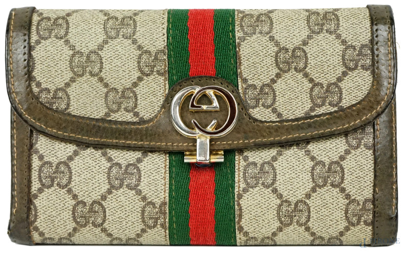 Gucci, portafoglio vintage in tela e cuoio con chiusura a monogramma, cm 10,5x17, (segni di utilizzo).  - Asta ASTA DI ARTE MODERNA, CONTEMPORANEA E VINTAGE - Aste Pirone